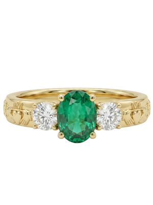 Gold ring with a green gemstone and two white stones on a white background
