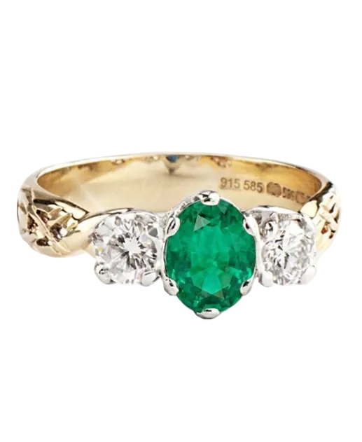 Gold ring with a green gemstone and diamonds on a white background