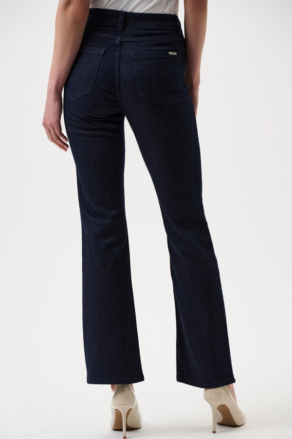 Navy blue pants worn by a person on a white background