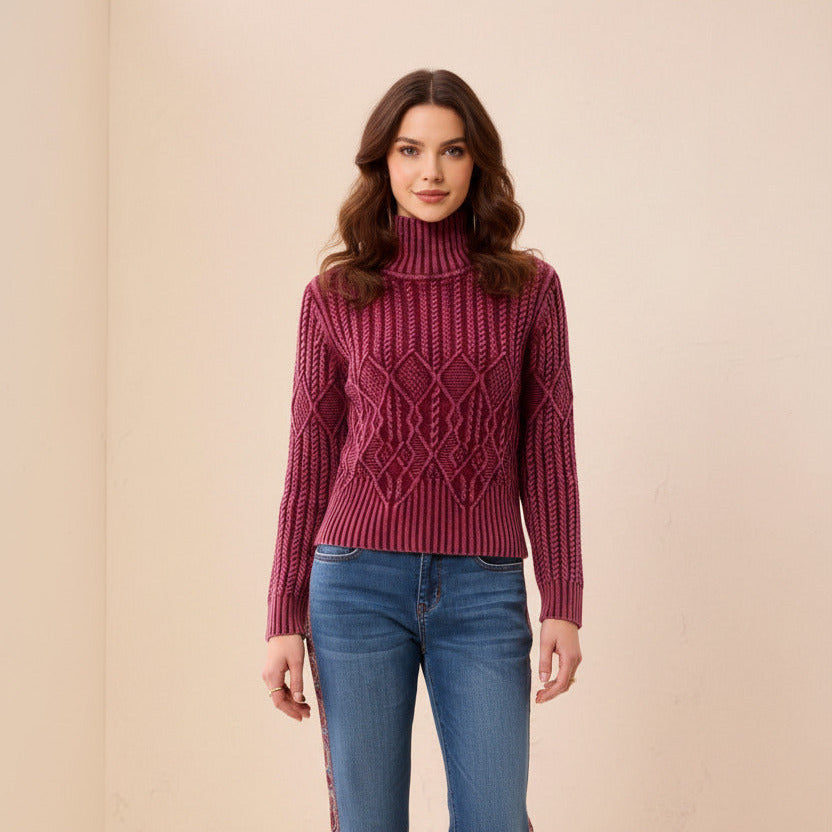 Person wearing a pink knitted sweater with a beige background