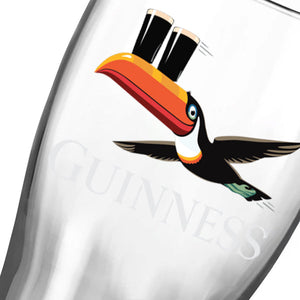 Guinness glass with toucan logo on a white background