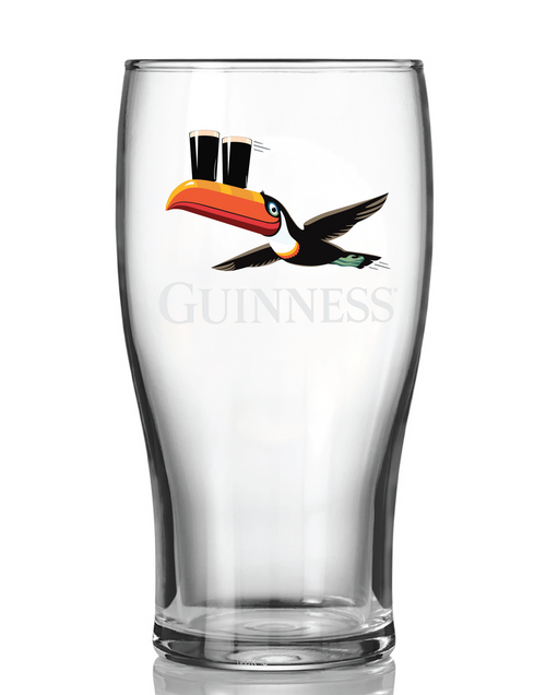 A clear Guinness pint glass featuring the iconic black-and-white bird with an orange beak holding two pint glasses, on a white background.
