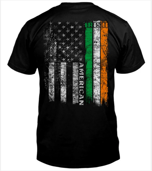 A black short-sleeve t-shirt shown from the back, featuring a distressed vertical graphic that combines an American flag design with the Irish tricolor (green, white, and orange) and the word 'AMERICAN'.